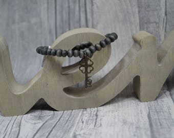 Bracelet gray elastic wooden beads