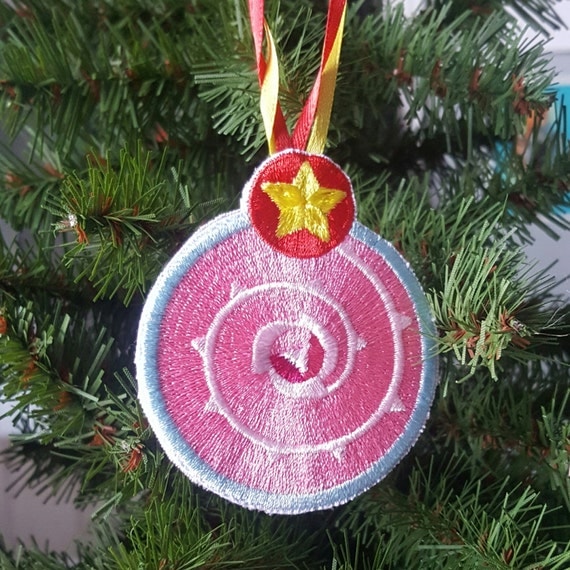 Merry Christmas!  This Steven Universe Rose Quartz Shield Ornament is perfect for the geek or geek in your life. Whether you use it as an ornament or to decorate your work space, this high quality embroidered ornament is sure to brighten up your day!  Each ornament comes with your