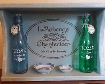 Shabby Chic duck egg blue shelving with French stenciled top