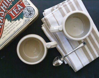 Two tankard style stoneware pottery tea mugs - glazed in simply clay