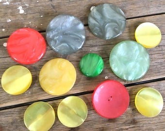 12 Large Buttons in green , yellow and red, biggest are 2.25 inch diameter