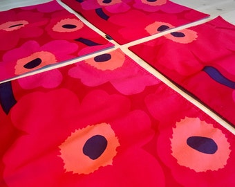 Four Marimekko Placemats in Unikko Pattern