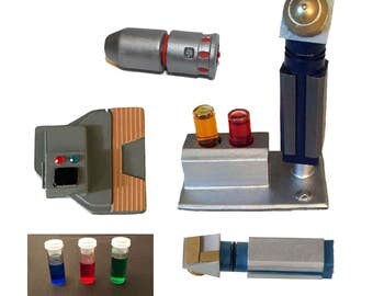 Awesome star trek medical kit - includes hypospray, stand, lots of vials, cortical stimulator and medical scanner.