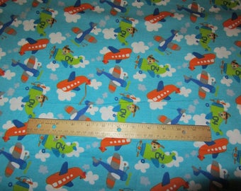 Blue Dogs in Airplane Flying in Clouds Flannel Fabric by the Yard