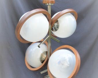 chandelier lighting vintage, lamp chromed metal glass and wood, half clear glass, lighting 4 lamps, with finish circles of wood, made ITALY
