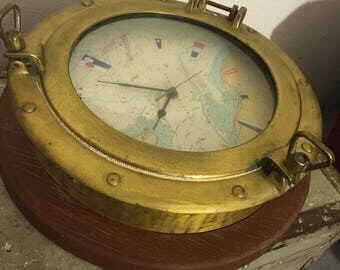 Porthole brass as a clock on teak brass porthole as clock