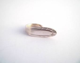T silver spoon ring. 60-61