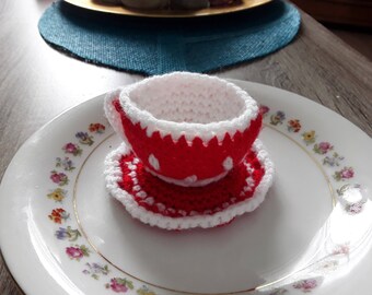 Cup and saucer with hand made crochet