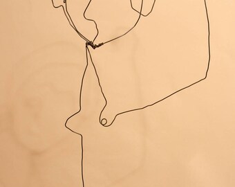 Wire: portrait of pensive girl in wire