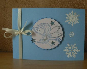 card flowing blue background and snowflakes
