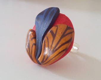 Ring round embossed pattern Blue Gold foliage on a red background