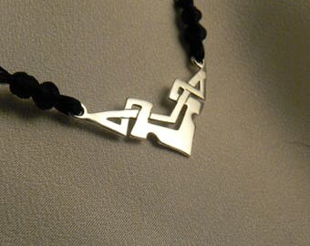 Pendant "intertwining" Silver mounted on cotton cord