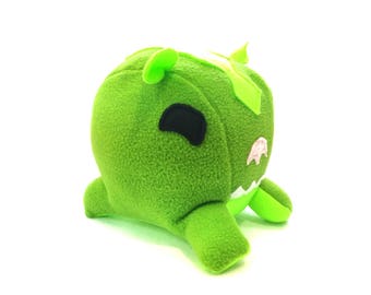 green alien stuffed toy