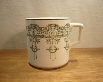 Antique early twentieth century semi-porcelain green and white mug by Clokie & Co of Castleford in Yorkshire