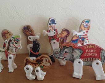 Fisher Price 902 Jr Circus set a camel, with a ringmaster, a dog, a seal, acrobats, a bear, a monkey, a clown, and an invisible parrot act