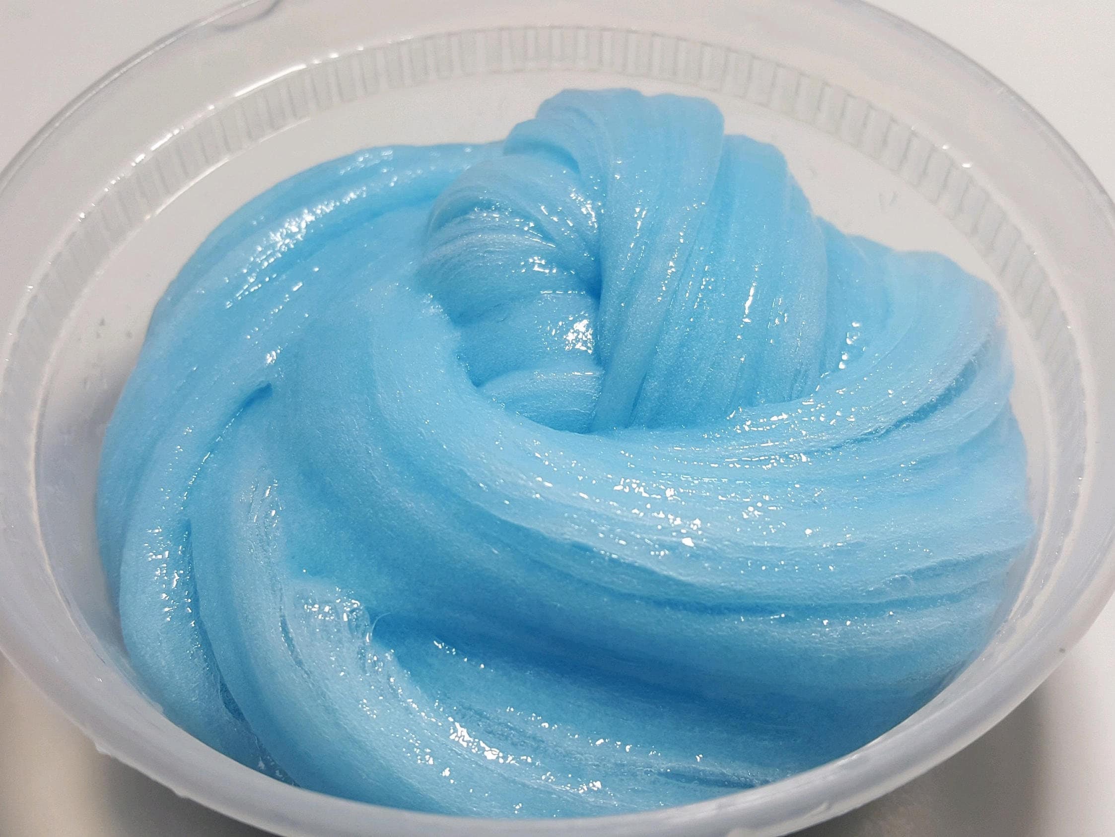 Blue Fluorescent Glow-In-The-Dark Slime from SlimeByNasir on Etsy Studio