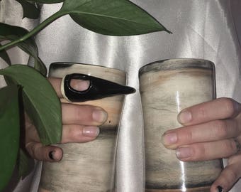 Pair of wheel thrown ceramic cups with brushed glaze