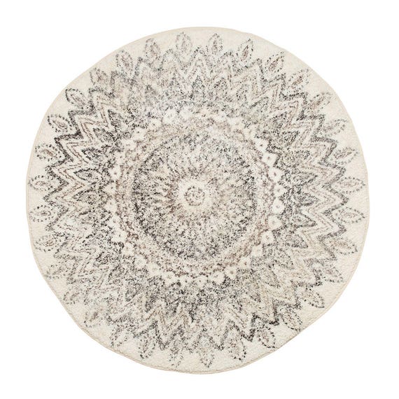 White and black patterned round rug