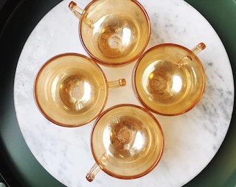 4, carnival glass teacups with embossed floral pattern