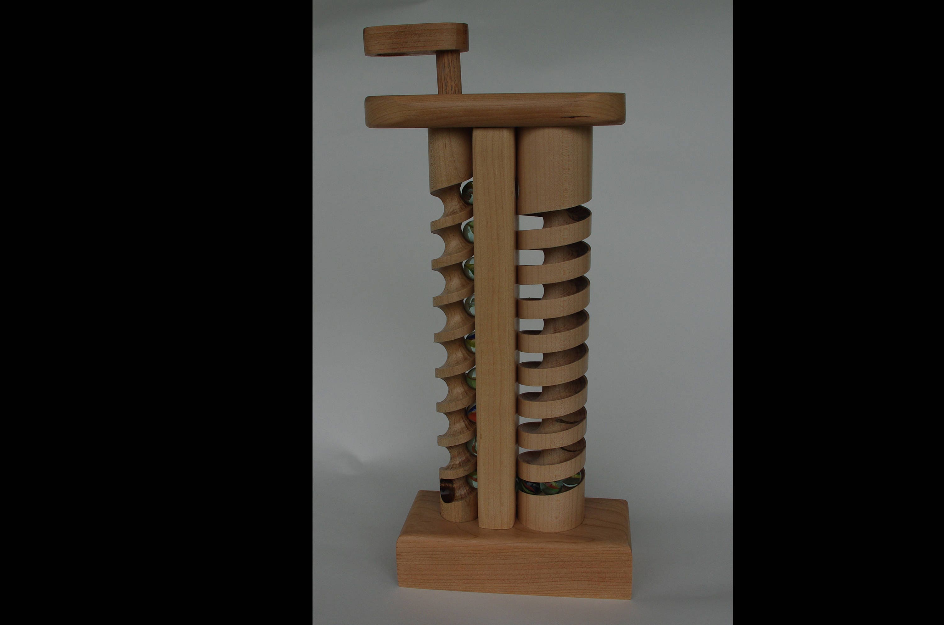The Crank A wooden toy with marbles hand crafted in Vermont.