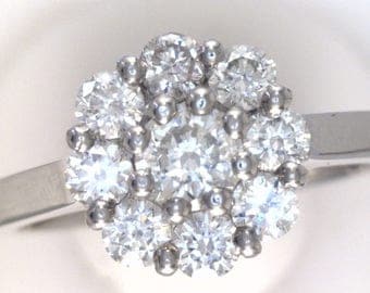 Round Cut Diamond Cluster Set Ring. In 100% Palladium.