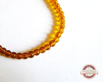 100 round glass beads 4mm transparent orange