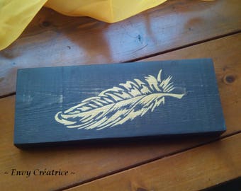 Painting "Golden Feather" on a black background pallet wood