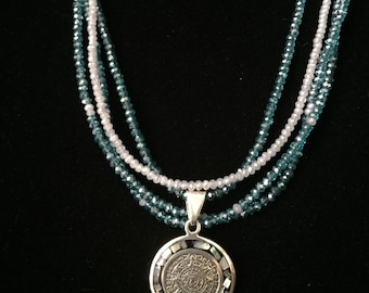 Multi strand necklace with Aztec sterling silver and mother of pearl pendant