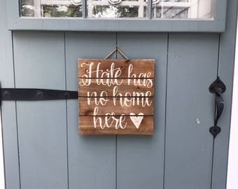 Hate has no home here sign