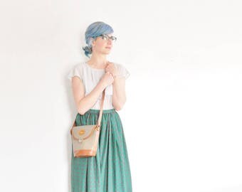 Dooney & Bourke crossbody bucket purse . putty gray and british tan genuine leather shoulder bag