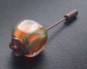 Fibula with floral and rounded square bead