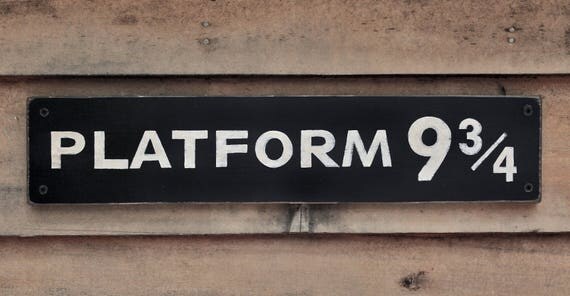 Vintage style wooden 'Platform 9 3/4' sign Hand