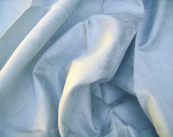 NO. 112 - SATIN TAFFETA AND POLYESTER - SKY BLUE FABRIC HAS WOVEN FLOWER MOTIFS