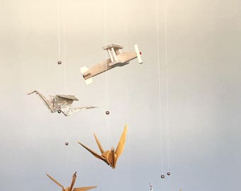 Wooden airplane and origami Crane mobile