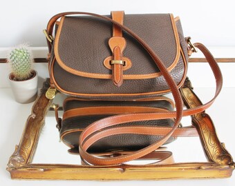 Vintage Dooney & Bourke Dark Brown Tan Two Tone All Weather Textured Leather Equestrian Strap Cross Body Messenger Satchel Saddle Bag Purse