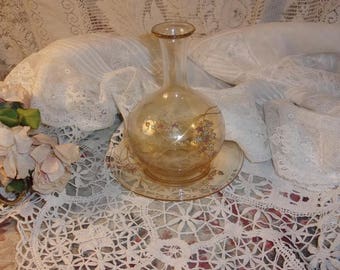 A charming old a little amber glass bedside carafe
