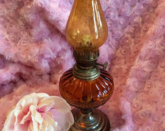 Vintage 9.5" amber glass oil lamp