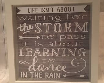 Life isnt about waiting for the storm to pass, it is about learning to dance in the rain box frame.
