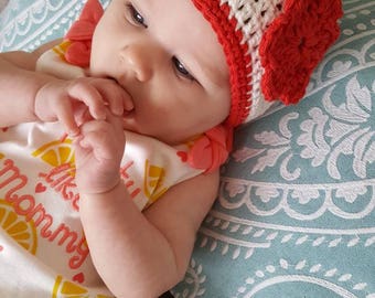 Baby Hat White with red trim and flower.