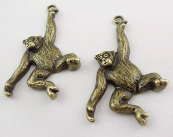 2 Breloques chimpanzés en métal bronze