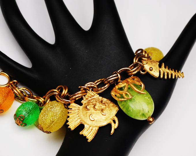 Cha cha Bracelet - colorful Tutti Frutti - gold fish -yellow orange green lucite - plastic - gold bell - dangle Bangle