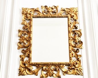 Antique French Grand Mirror, An Opulent Mirror in a Masterfully Hand Carved and Gilded Wood Frame, 19th Century