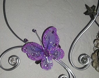 Set in aluminum with a butterfly