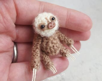 Miniature, baby, sloth, jointed, two toed sloth.