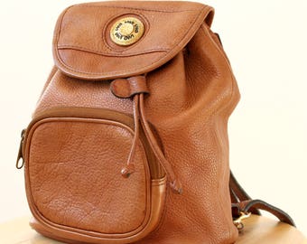small tan leather backpack
