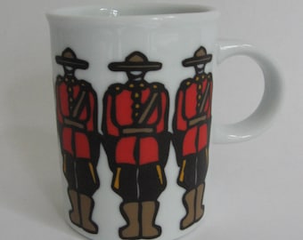 Mug from Canada by Marc Tetro depicting Mounties