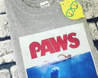 Paws Jaws parody cat t-shirt. Unisex. All sizes. Available in grey/white.