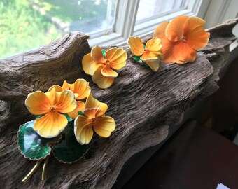 Gorgeous vintage estate orange pansy design jewelry set. Marked Made In West Germany. Enamel over copper, brooch and earring set.