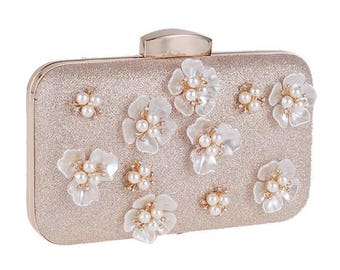 white clutch with gold