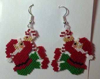 Christmas, my creation is handmade earrings woven Santa payote